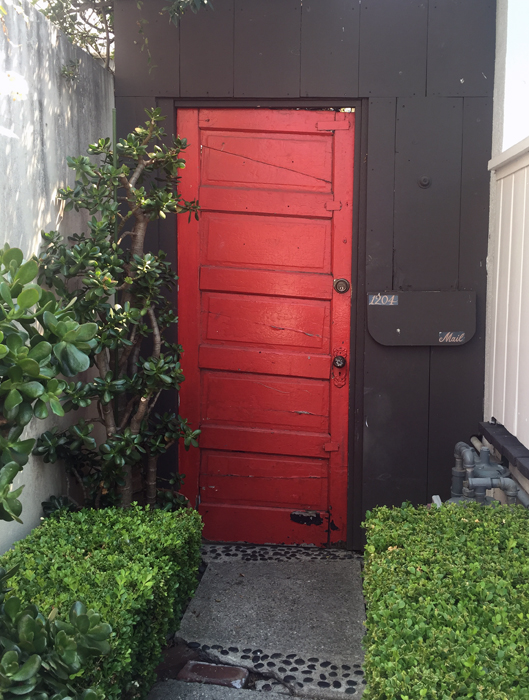 crooked red door